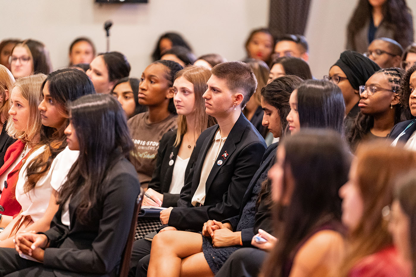 Students listening to panel discussion