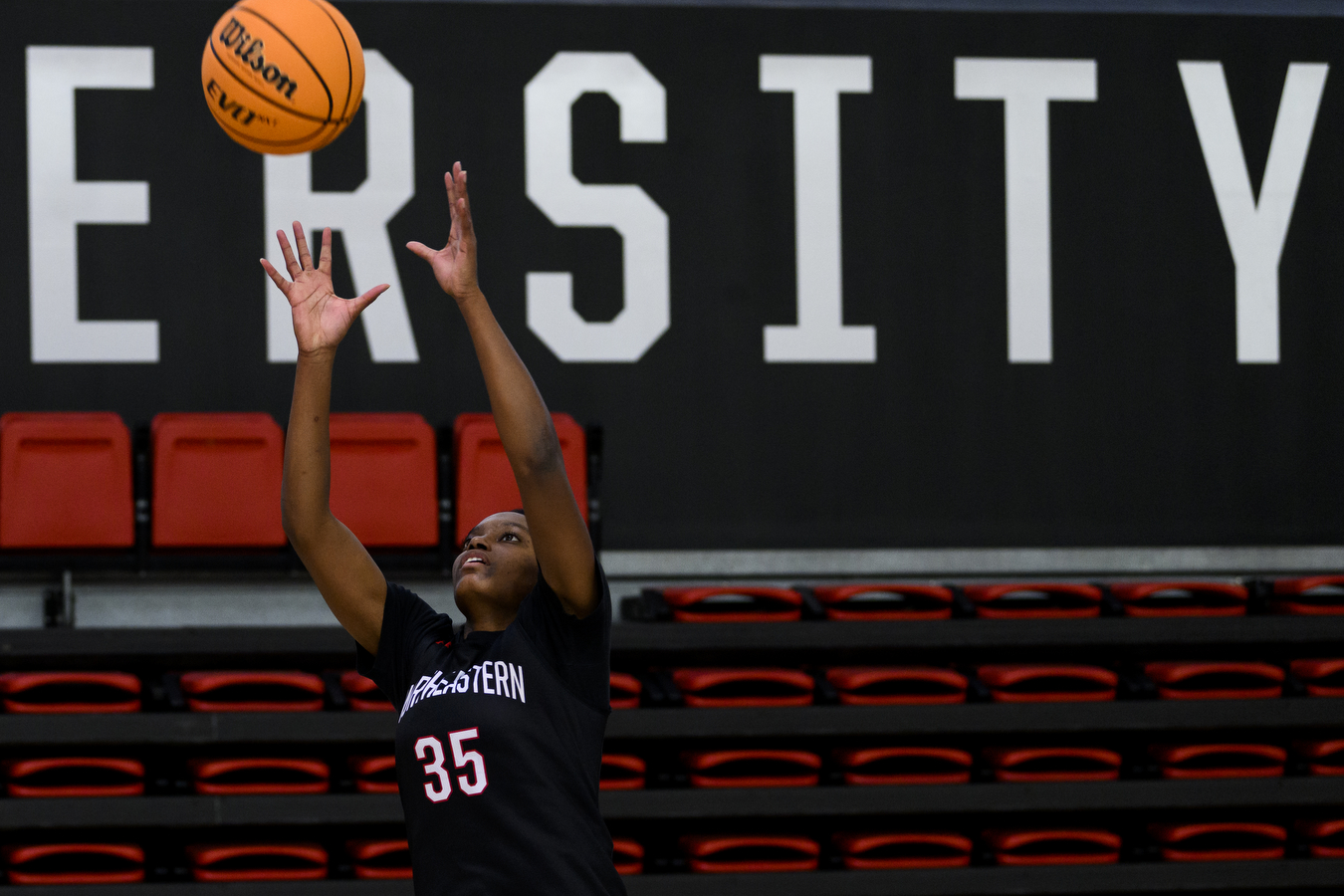 halle idowu shooting a basketball