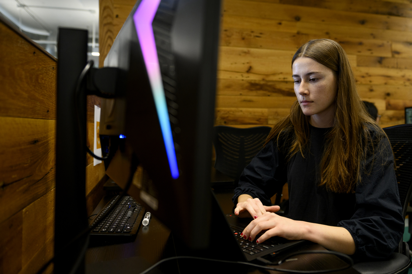 Rhyann Clarke working at a computer