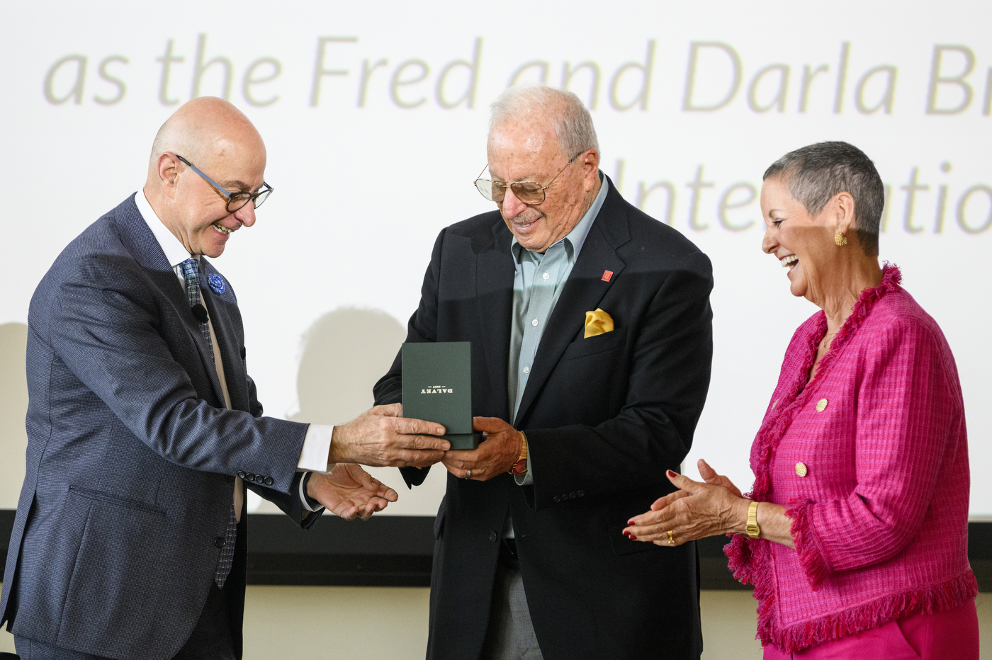 president aoun presenting an award to two people