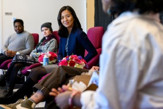 mayor michelle wu sitting with other people