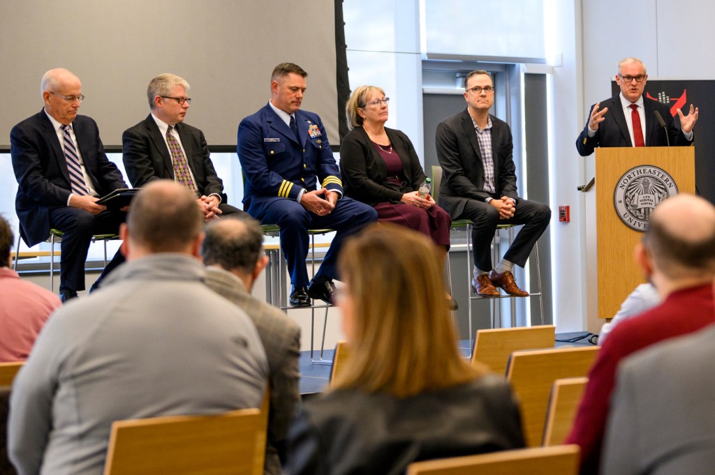 Six people participate in a panel discussion.