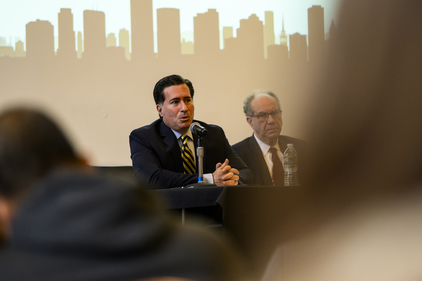 professor speaking into a microphone