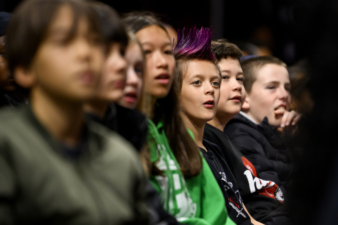 students watch basketball game