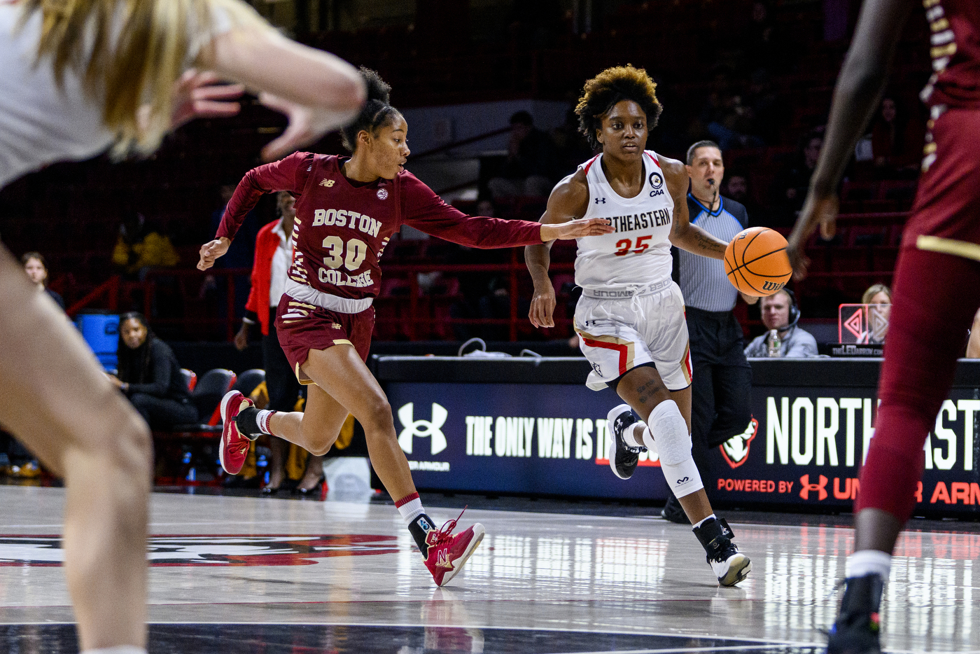 womens basketball player dribbling down court