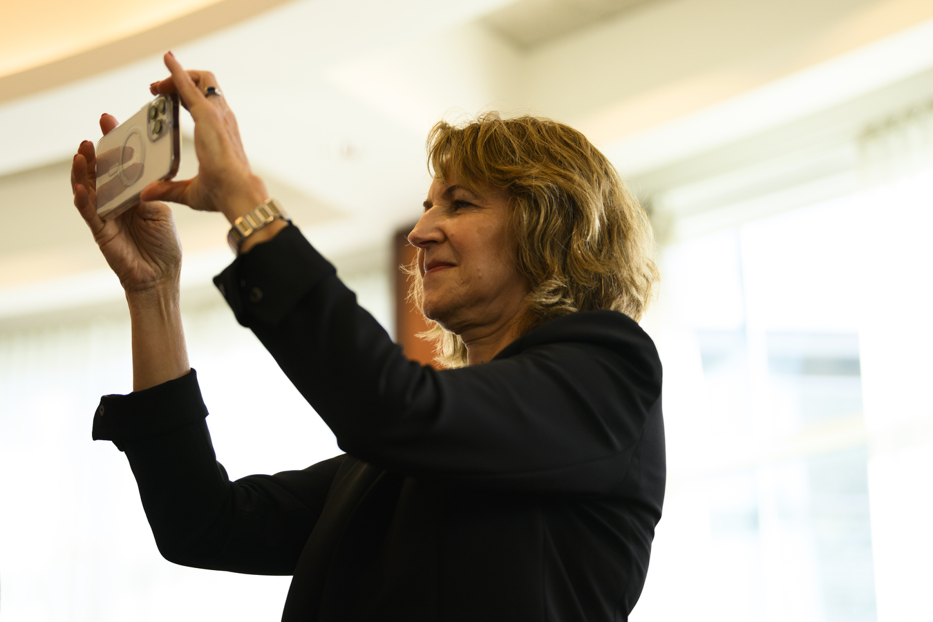 Woman taking a photo at event