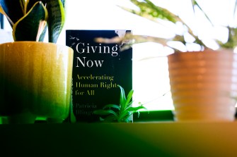 Giving Now book standing up on a table