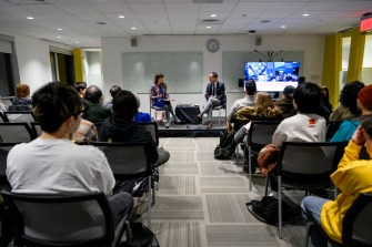 audience members at a conference discussion