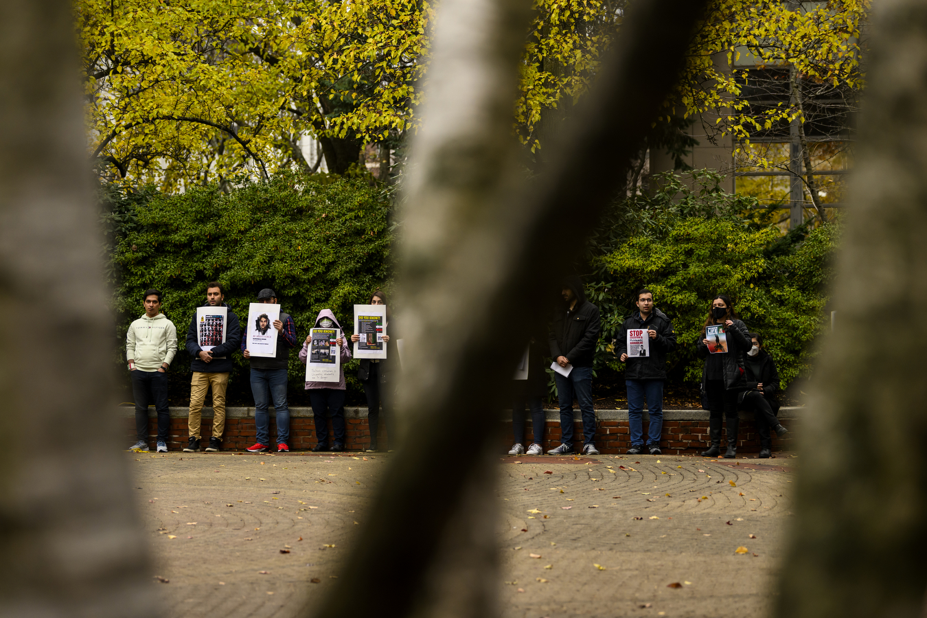 line of students holding protest signs