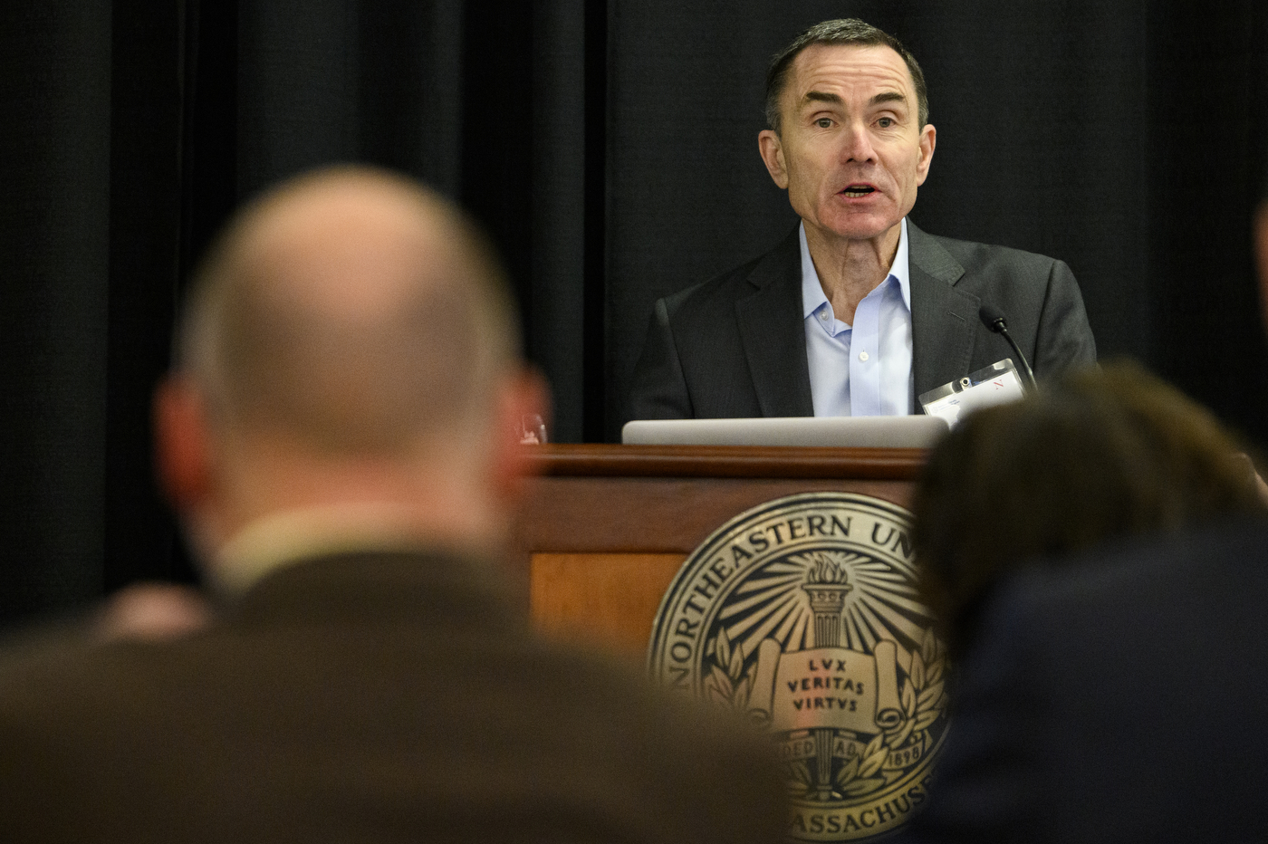 person speaking at podium