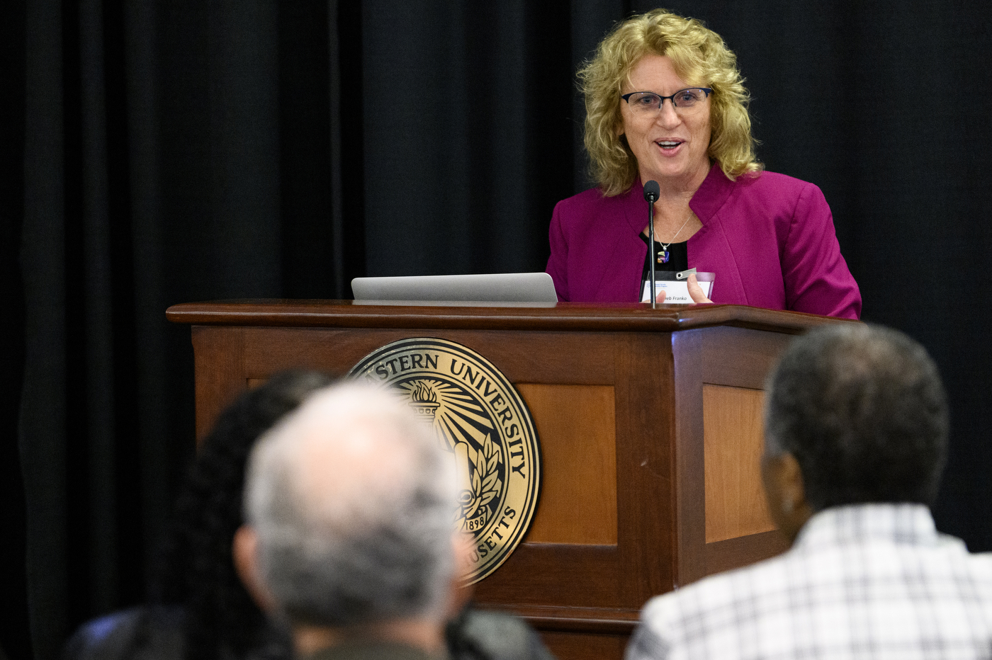 person speaking a podium