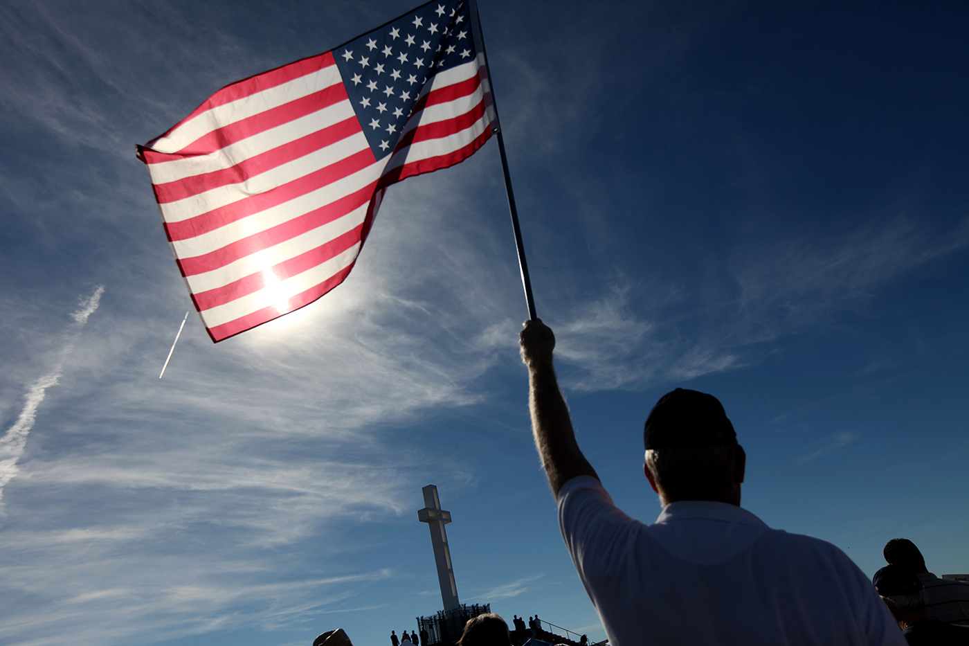 person holding united states flag