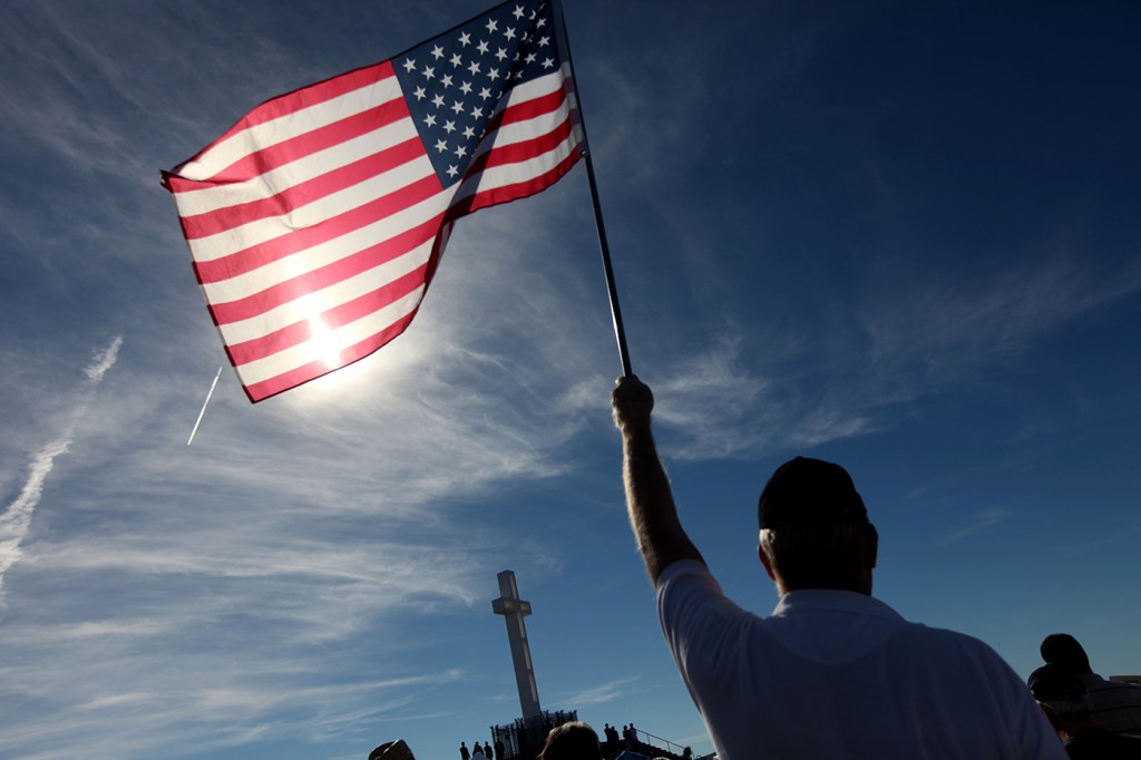 person holding united states flag