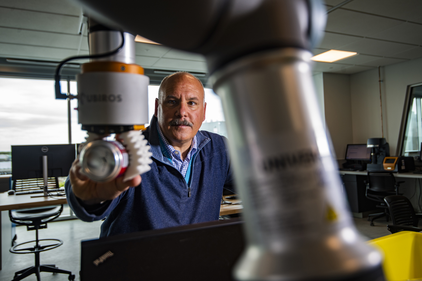 jack lesko manipulates machinery at his desk