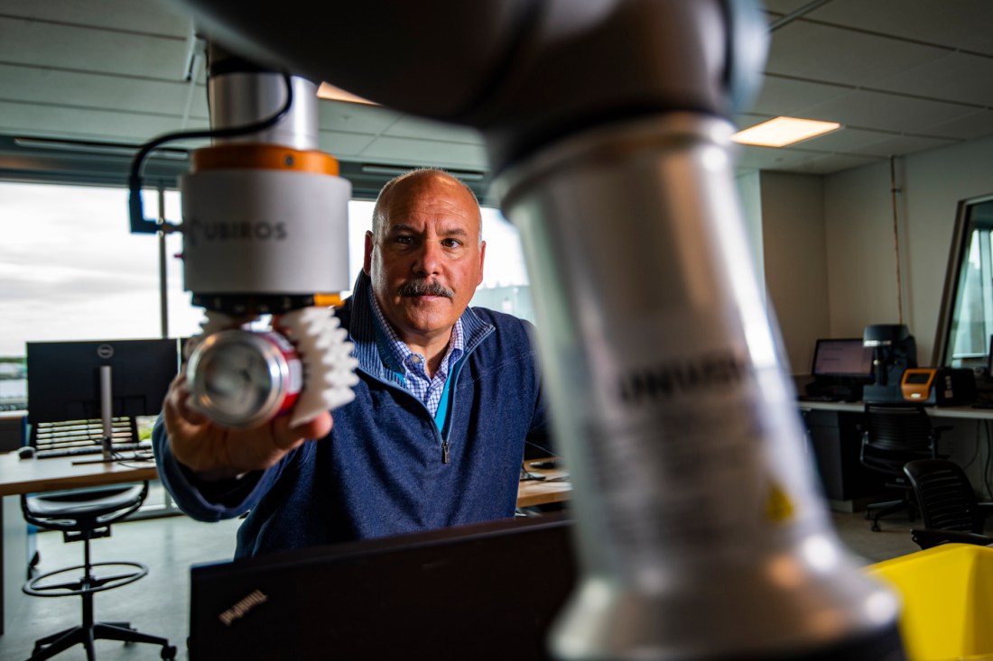 jack lesko manipulates machinery at his desk