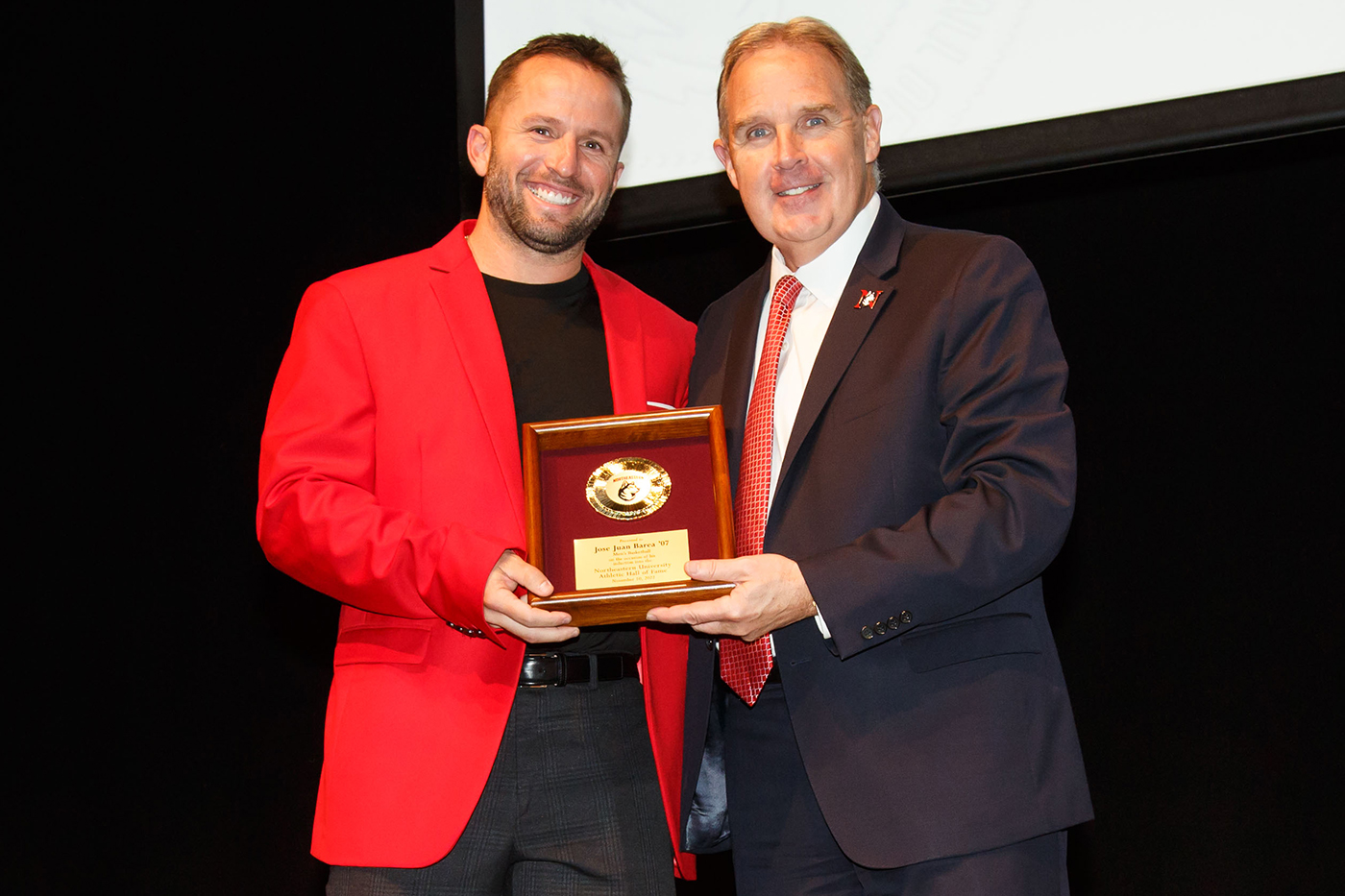 jim mmadigan posing with inductee