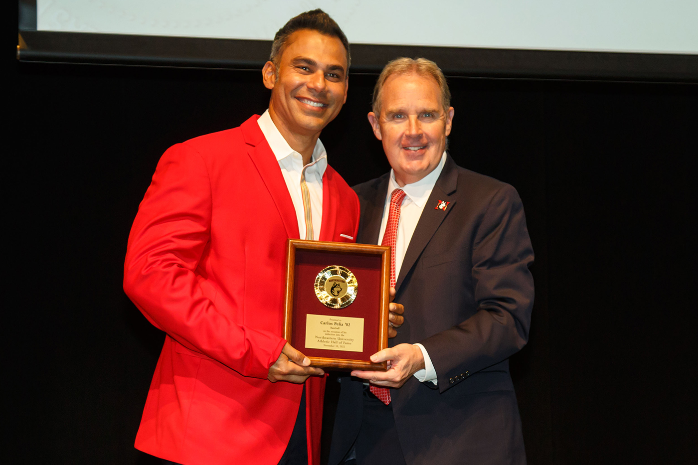 jim madigan posing with inductee