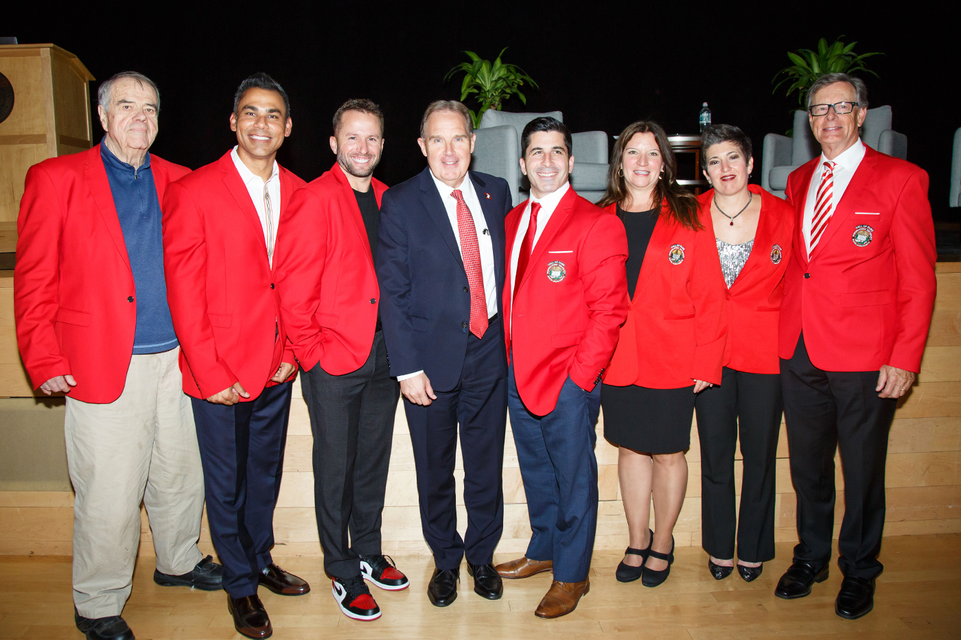 jim madigan posing with group of inductees