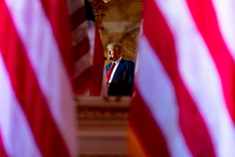 president trump speaking at a podium