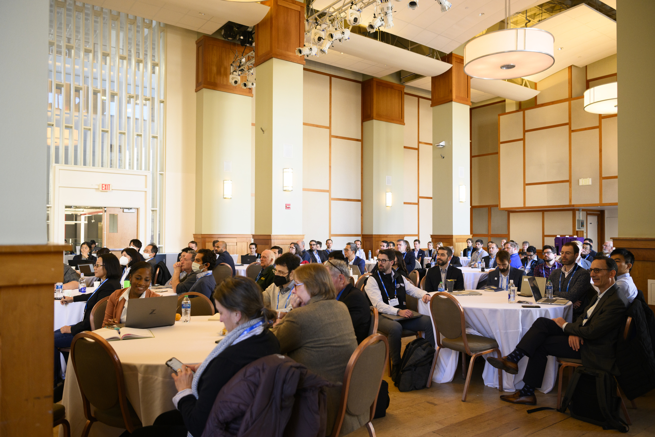 A large group sits at round tables at this year's National Offshore Wind Research & Development Symposium 2022.