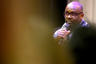 lilian thuram speaking into microphone