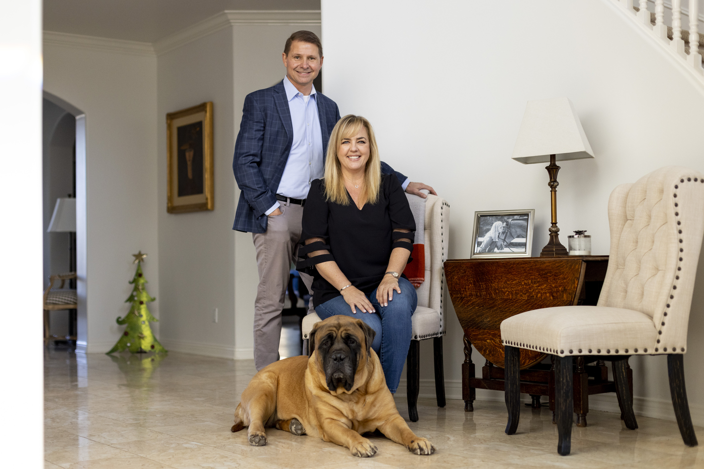 john and nicole nadolenco posing inside their home