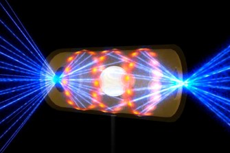 A target pellet inside a hohlraum capsule with laser beams entering through openings on either end.