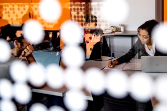 student working on a project at a desk