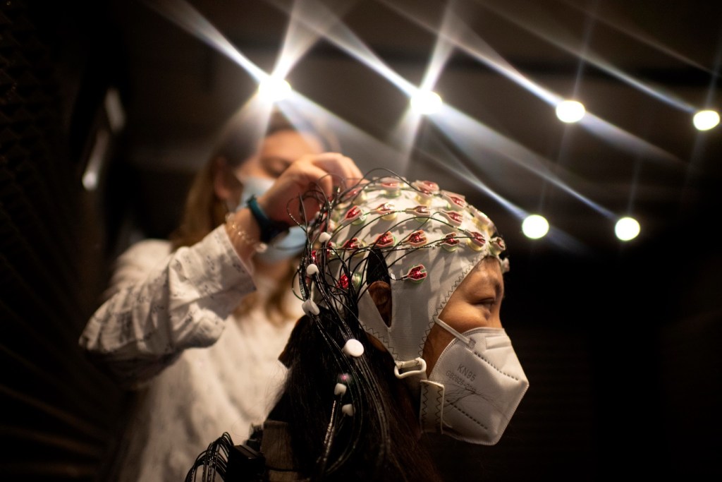 person wearing brain cap for research