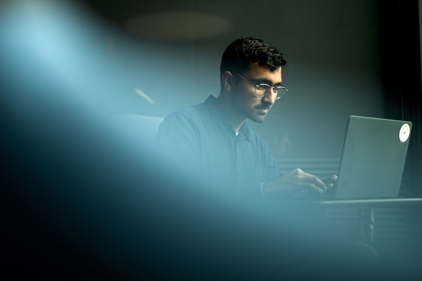 Vivek Kanpa working on a laptop