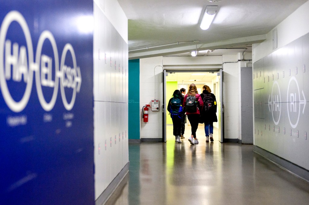 students walking in underground tunnel