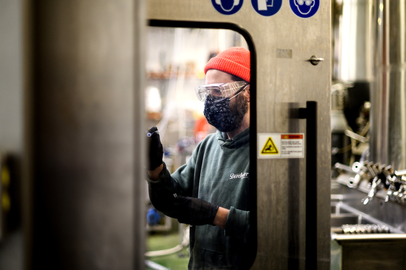 Person working in Rupee Beer manufacturing