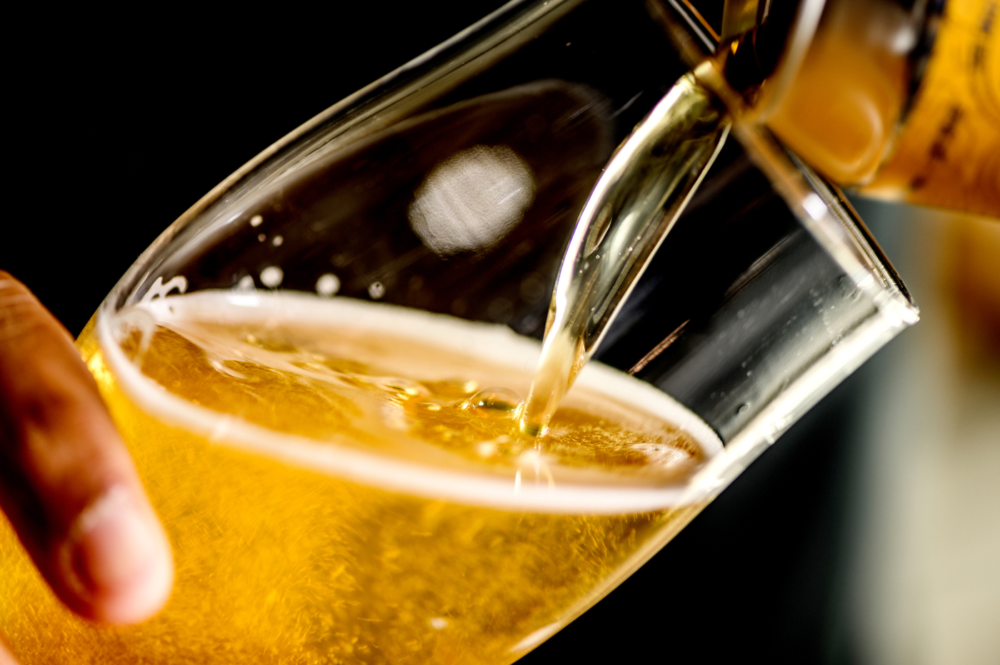 Rupee Beer being poured into a glass