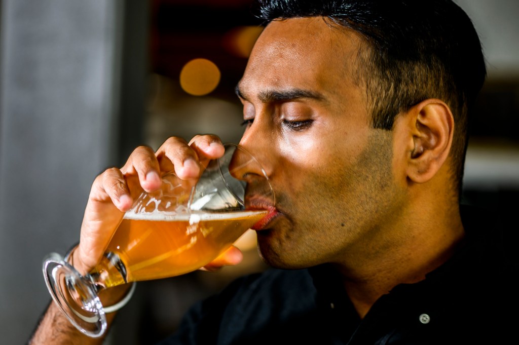 Vanit Sharma drinking Rupee Beer