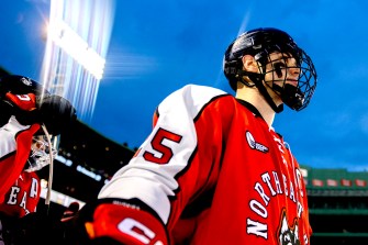 aidan mcdonough lined up to play hockey at fenway park