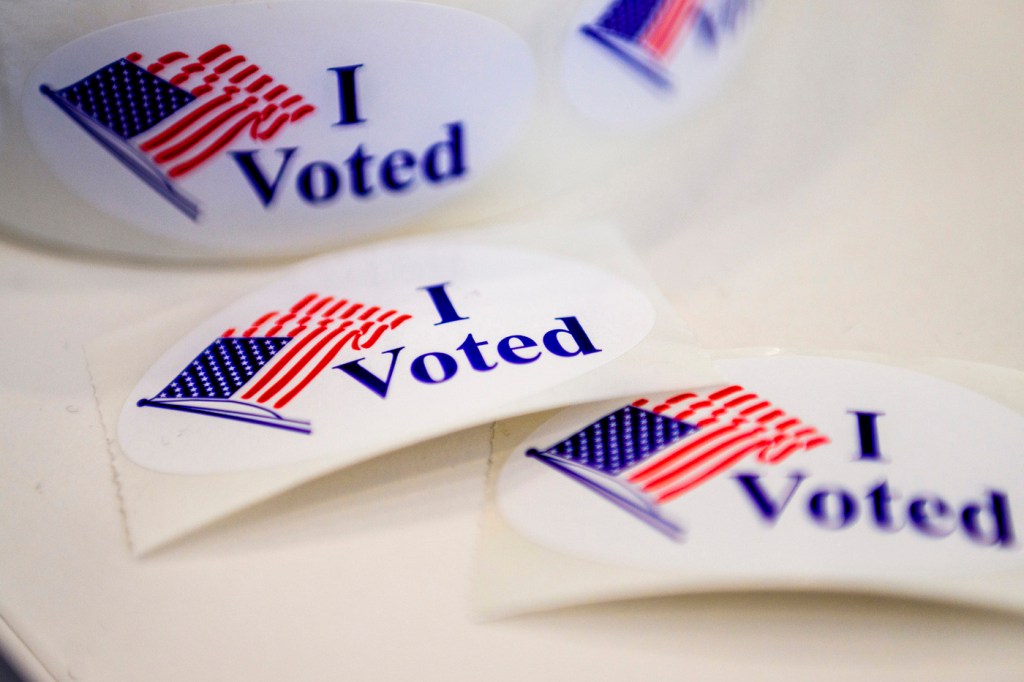 'i voted' stickers on a white table