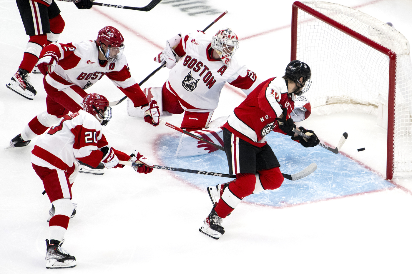 northeastern hockey player scoring on boston university