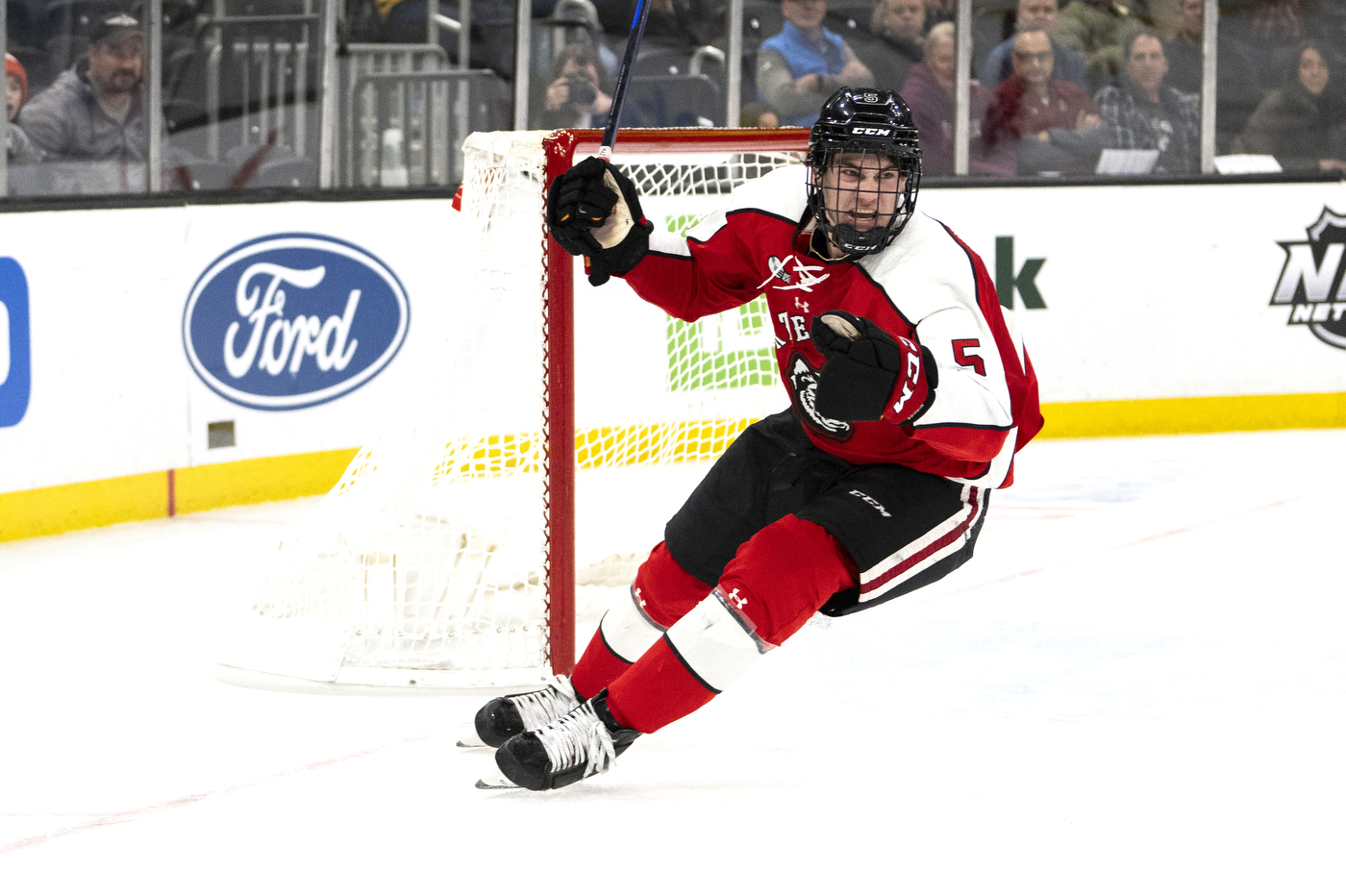 hunter mcdonald skating in front of the hockey net