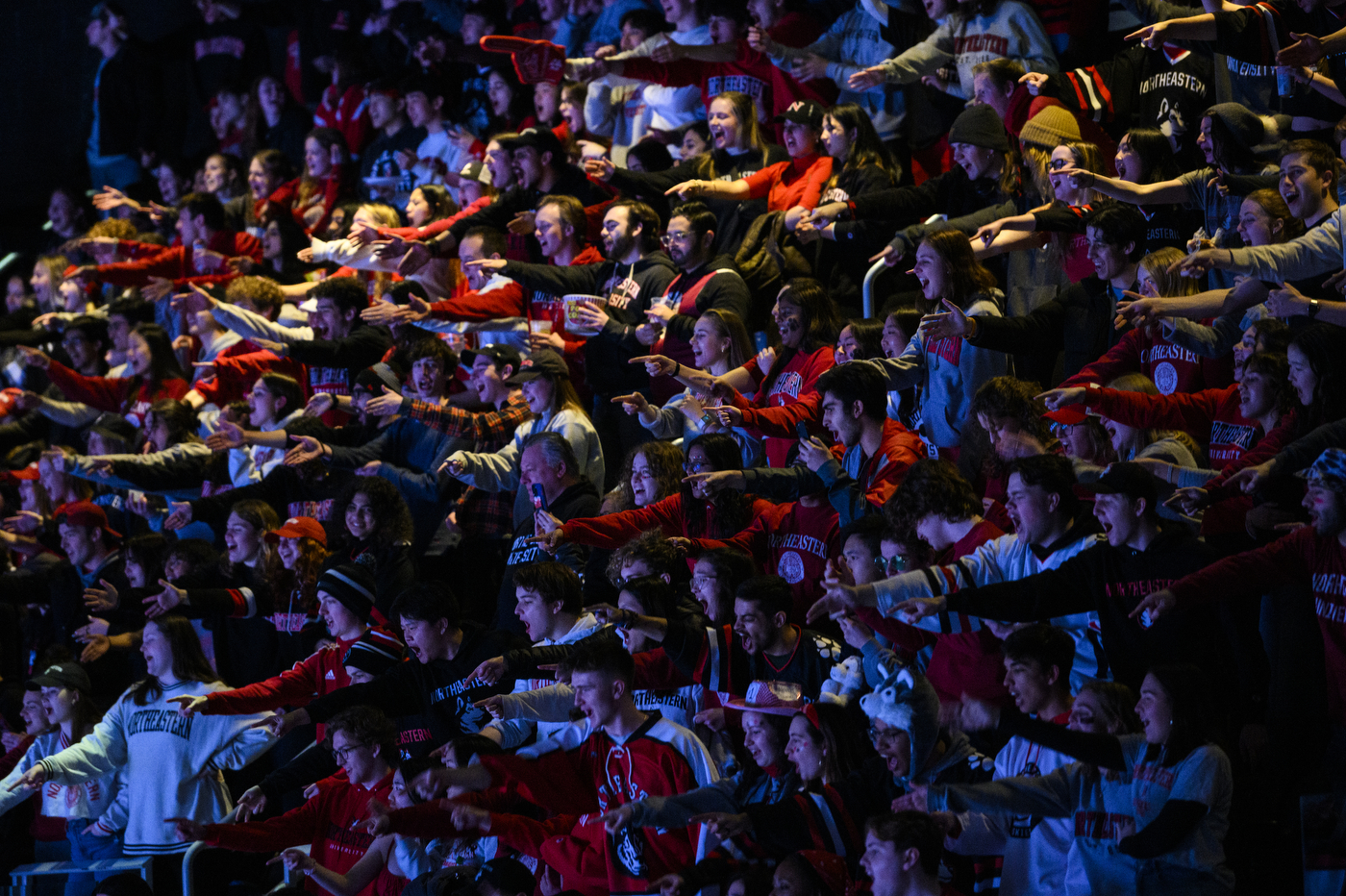 northeastern fans cheering on the hockey team