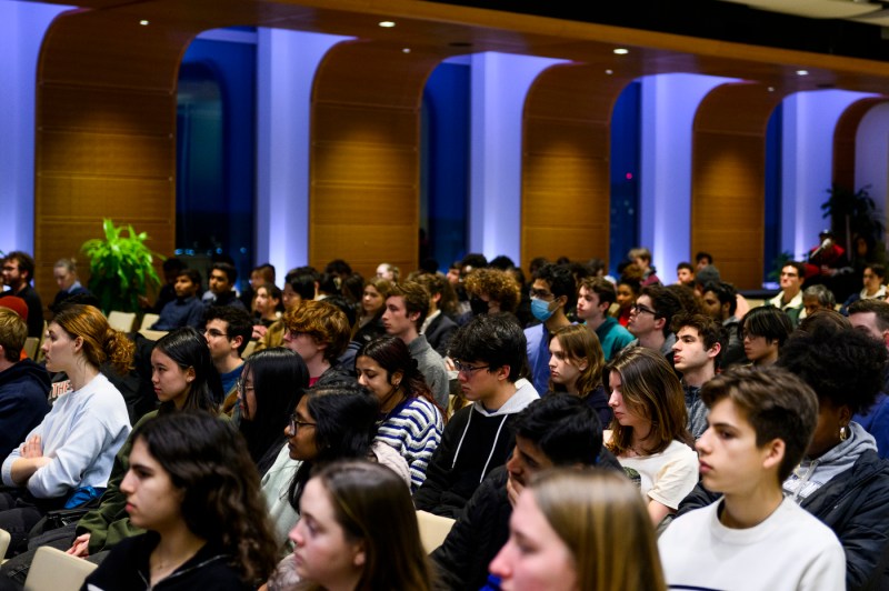 A crowd watches a presentation