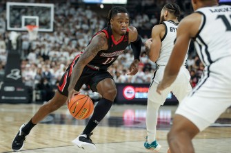 Jahymyl Telfort dribbling the ball down the basketball court