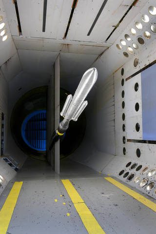 a small rocket flying in a wind tunnel