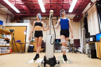 Ballet dancers hooked up to a machine to measure their balance and form.