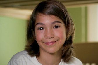 Mia, smiling at the camera, who has volunteered to help with Cerebral Palsy research.