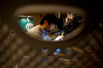 Nick Scaperdas working on a lab on a deaf blind accessible doorbell