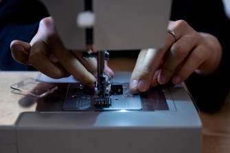 person using a sewing machine