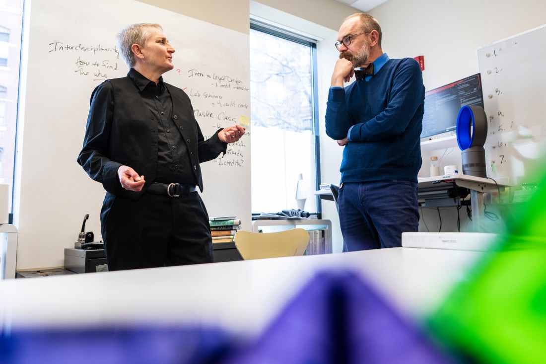 dan jackson and jules sievert having a conversation in an office