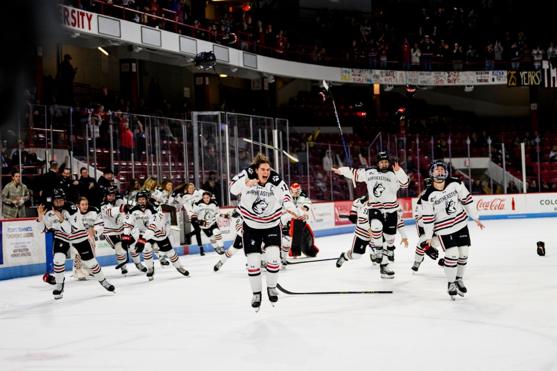 Players stream onto the ice in celebration