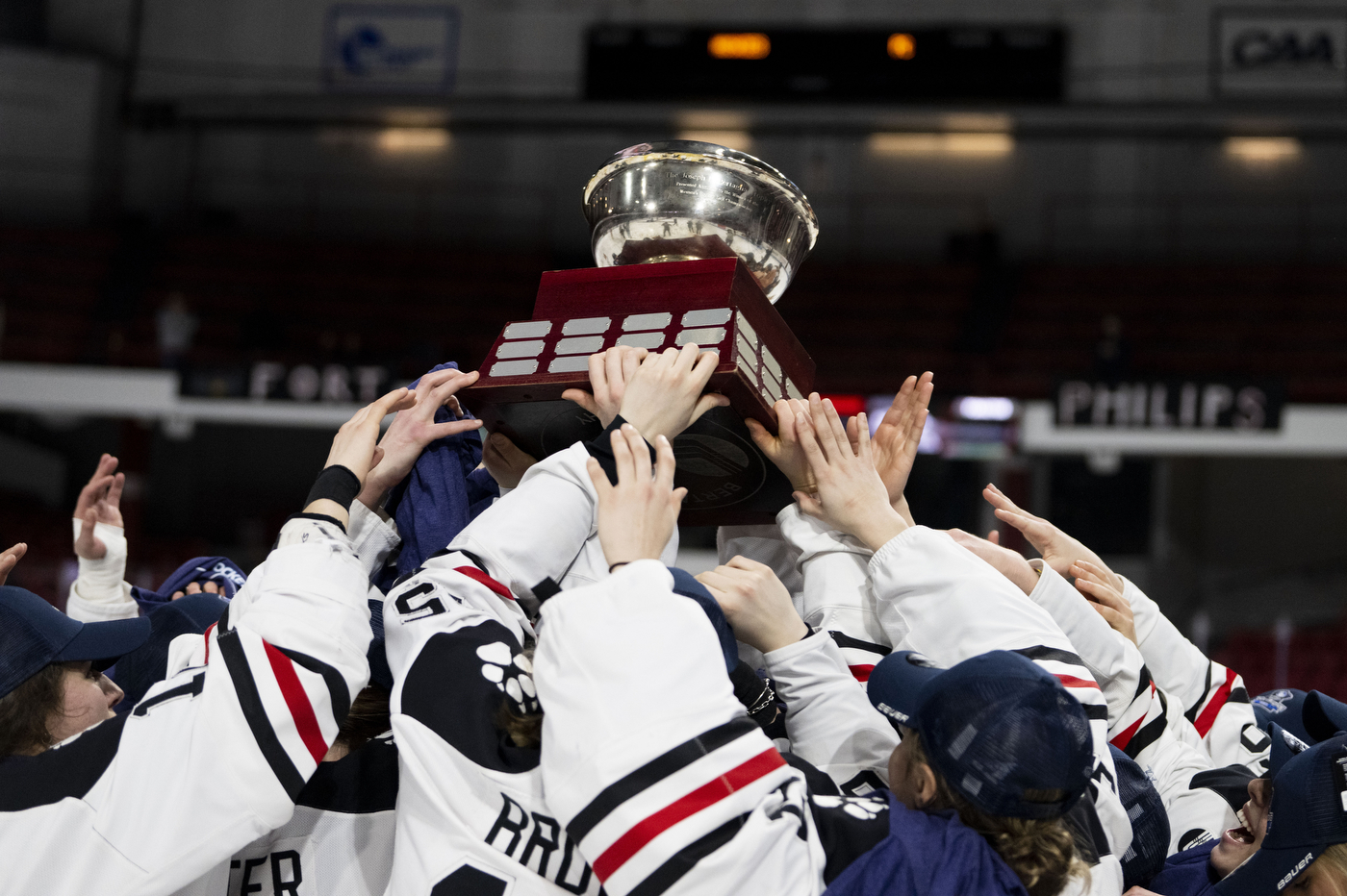 Players raise a trophy