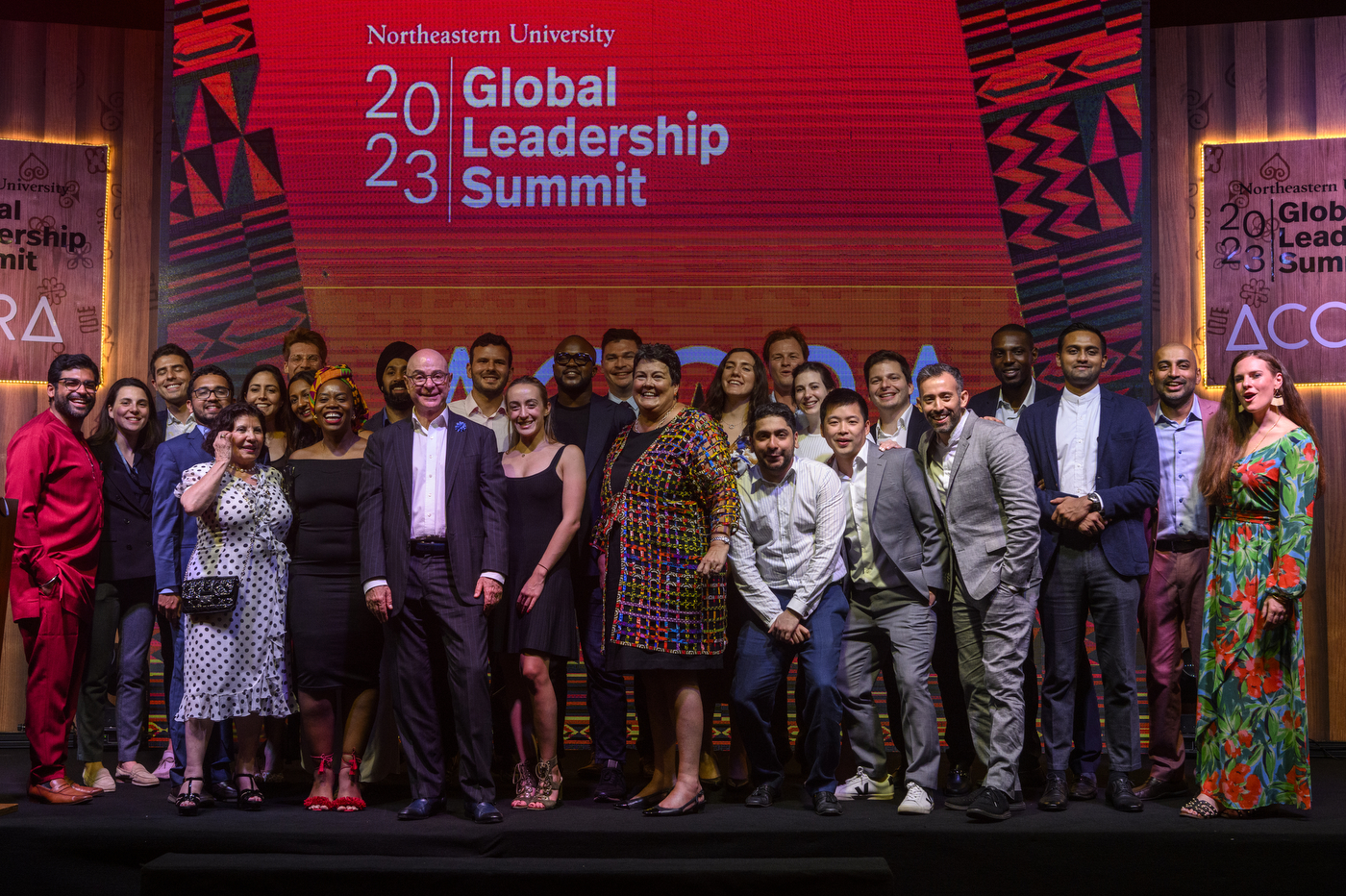 U.S. Ambassador to Ghana Virginia E. Palmer and Northeastern President Joseph E. Aoun and Northeastern young global leaders standing on a stage